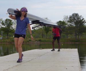 Spring break rowers in Oak Ridge on dock carrying double