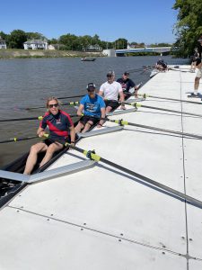 Photo of people in boats at dock.